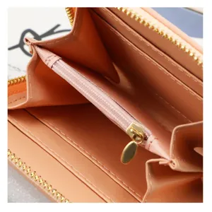 Detailed view of the women short wallet interior featuring multiple card slots and zipper coin pocket.