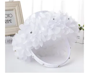 White lace flower basket with rhinestones for wedding flower girl and ceremony decor.