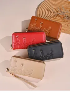 Detailansicht von Damen langen bestickten Brieftaschen mit Reißverschluss in vielen Farben.
