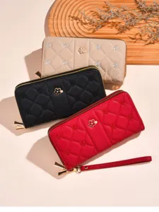 Women's quilted long zipper wallet with embroidered flowers and chic metal charm design.