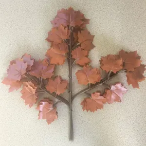 Artificial red maple leaf branch detail, plastic autumn foliage for home and outdoor decor.