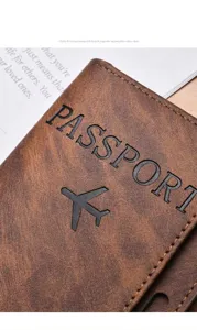 Close-up detail of retro brown faux leather passport holder with embossed text texture design.