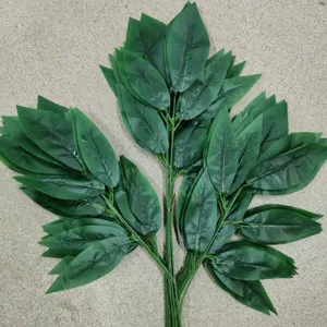 Artificial mango leaf branch, detailed view of green fake leaves for home garden decor.