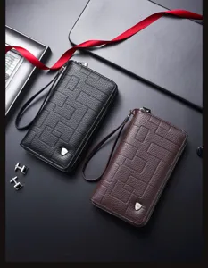 Monedero largo de hombre con doble cremallera y cuero texturizado geométrico.