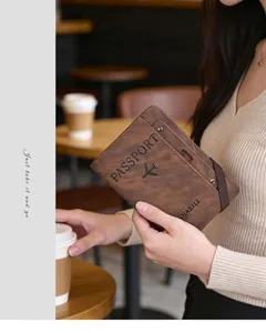 Multifunctional brown PU leather passport holder wallet with card slots and elastic band.