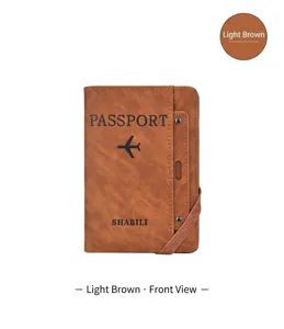 Brown PU leather passport holder travel wallet with card slots and secure elastic band detail.