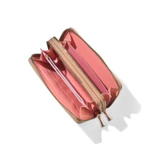 Detail view of open women's long double zipper wallet with pink multi-slot interior.
