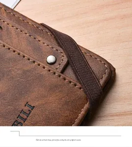 Detailed view of the multi-functional brown leather passport holder with elastic band.