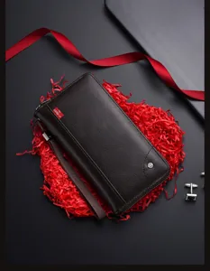 Men's long business wallet detail view, premium dark brown leather clutch with multiple card slots.