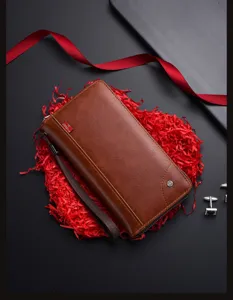 Men's brown long leather wallet business retro clutch bag with card slots and wrist strap.