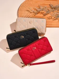 Stylish women's long quilted zippered wallet set with elegant embroidery and metal flower charm.