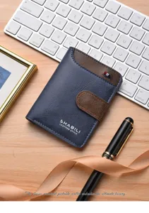 Close-up detail view of men's leather wallet with contrast color snap closure and card slots.