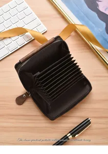 Close-up of brown accordion card holder interior showing multiple card slots and secure zip pocket.