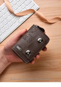Detailed view of vintage brown leather wallet featuring dual magnetic snaps and zipper.