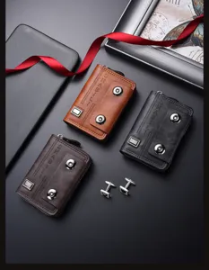 Detailed view of men's multi-card accordion wallet with double snap closure and metal badge.