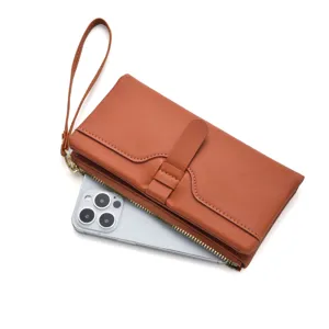 Women long PU leather wallet clutch wristlet bifold card holder phone pocket in brown.