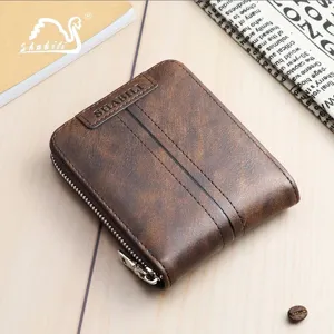 Brown vintage short zipper wallet with vertical stitch detail and metal puller for men.
