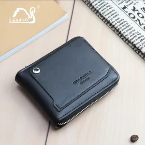 Close-up detail of black men's short wallet with smooth zipper and card slot design.