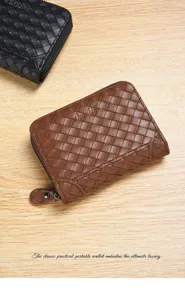 Detailed view of brown woven leather zipper wallet featuring classic artisanal craftsmanship style.