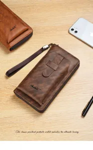 Detailed view of brown men's long wallet with wrist strap, multi-card slots and secure zip design.