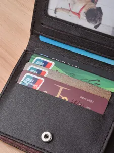 Men's short leather wallet with multiple card slots, snap closure and coin pocket zip design.