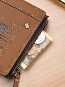 Mens short brown wallet with zipper pocket and snap button, compact card holder design.