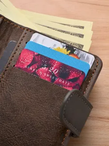 Men's retro short brown leather wallet with snap closure, multiple card slots and cash pocket.