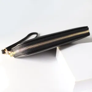 Black long zipper wallet for women with wrist strap, showing detailed metallic hardware.