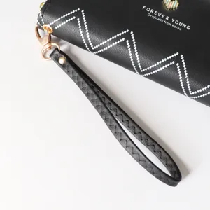 Black long women's wallet with wrist strap chic white zigzag pattern zip closure clutch bag