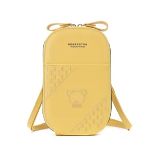 Cute yellow vertical phone crossbody bag, PU leather purse with bow and bear embroidery.
