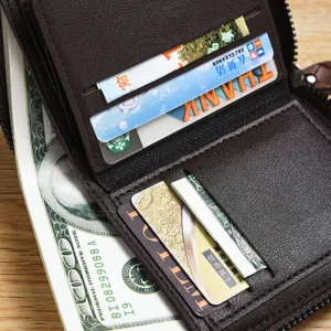 Men's brown short leather zipper wallet with multiple card slots and cash compartment.