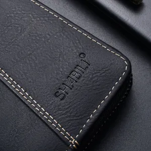Black leather long wallet for men with zipper closure and detailed contrast stitching.