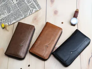 Detailed view of multi-function long wallets in black and brown leather. Perfect capacity.