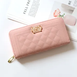 Elegant pink quilted long wallet for women with secure zip closure and stylish gold hardware.