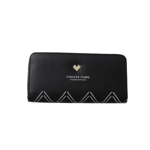 Black long zip wallet with heart metal emblem and geometric wave stitching design for women.