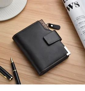 Men's short leather wallet with snap closure, card slots, and stylish metal corner design.