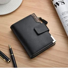 Men short black wallet detail showing soft leather texture, snap closure and metal corner accent.