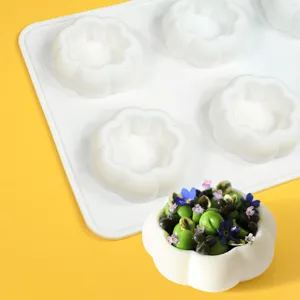 Close-up detail of white silicone flower baking mold showing finished dessert presentation.