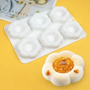 Detailed view of the 6-cavity white flower silicone mousse cake mold and finished dessert.