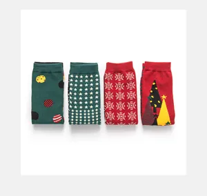 Detailed view of festive Christmas mid-calf socks featuring colorful dots, stars, and trees.