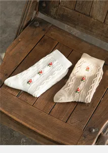 Cable knit cotton socks featuring delicate embroidered floral details, cozy autumn winter hosiery.