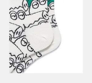 Detail view of cotton mid-tube socks with funny cartoon animal pattern and green cuff.