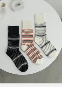 Detailed view of trendy striped cotton mid-tube socks in classic black and white.