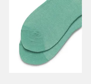 Detailed view of green knit socks toe, breathable mesh cotton, solid color, comfortable daily wear.