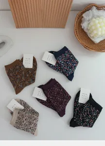 Detailed view of vintage style floral pattern cotton mid-tube socks for women, retro cute aesthetic.