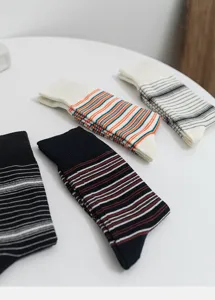 Close-up of stylish striped cotton mid-calf socks showcasing fine texture and trendy design.