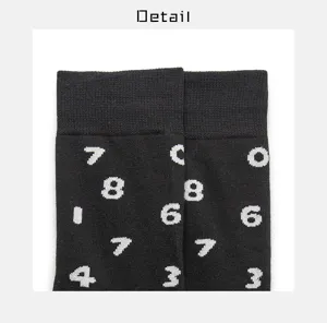 Unisex streetwear black cotton socks featuring stylish white number prints for couples casual wear.