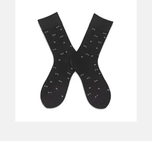 Detail shot of black cotton mid tube socks with white letter prints. Great streetwear choice.
