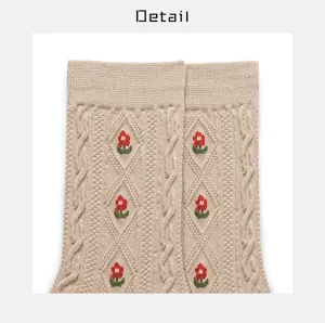 Beige cable knit mid-tube cotton socks with cute red floral embroidery, vintage style detail.