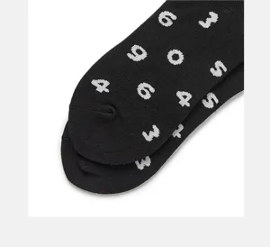 Black mid-calf casual socks with white numbers print, stylish streetwear design for daily wear.